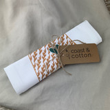 UAB Blazer Heart towel hanging in a bright kitchen, Alabama-made cotton flour sack towel with green and gold heart design