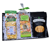 Alabama Indulgence gourmet snack gift with ranch crackers, peanut brittle, key lime white chocolate cookies, kettle corn and salsa poppers in a keepsake tray.