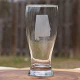 Alabama pilsner glass with etched state design on a clear beer glass, made in Alabama, styled with craft beer
