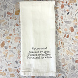 Funny mom kitchen towel in blue flour sack cotton, styled in a bright kitchen setting, showcasing printed humor design, Alabama-made gift item