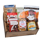 Indulge Me Alabama gourmet gift box with cookies, cheese straws, Pecan Bliss Popcorn, Mule Mix, BBQ crackers, praline pecans, roasted peanuts and salsa poppers.