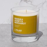 Manuka Honey and Bergamot candle in glass jar.