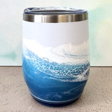 Ocean-inspired hand-painted wine tumbler with turquoise and blue coastal wave design, insulated stainless steel drinkware for wine, cocktails, and beach gifts