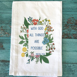 Floral scripture tea towel with Matthew 19:26 displayed in a flower-framed border on a soft white cotton kitchen towel