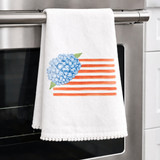 hydrangea flag tea towel with blue floral and red stripes, decorative kitchen towel with pom trim for summer and patriotic gifts