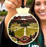 UAB Campus Green wooden ornament featuring a detailed illustration of the iconic University of Alabama at Birmingham quad, natural wood finish, and black hanging ribbon.