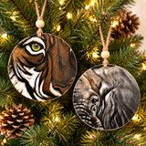 Eye of the Tiger OR Eye of the Elephant ornaments, each with detailed animal artwork, wooden Alabama-made hanging ornaments featuring rustic jute cords and nature-inspired design.
