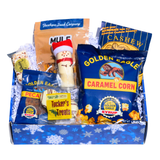 Southern Snowfall Alabama holiday gift box with caramel corn, divinity, cashews, white chocolate treats, Mule Mix and mini pecan pie in festive packaging.