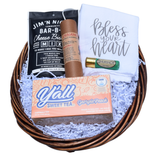 Southern Hospitality gift basket with Alabama-made peach sweet tea, cheese biscuit mix, chili and dip mixes, and a Bless Your Heart kitchen towel.