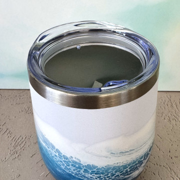 Ocean-inspired hand-painted wine tumbler with turquoise and blue coastal wave design, insulated stainless steel drinkware for wine, cocktails, and beach gifts