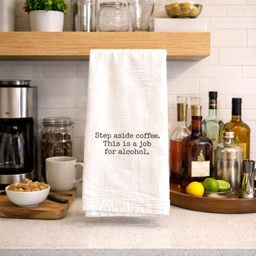 Funny “Step Aside Coffee This Is a Job for Alcohol” cotton tea towel displayed in kitchen and home bar setting, decorative and functional gift for wine lovers and cocktail enthusiasts