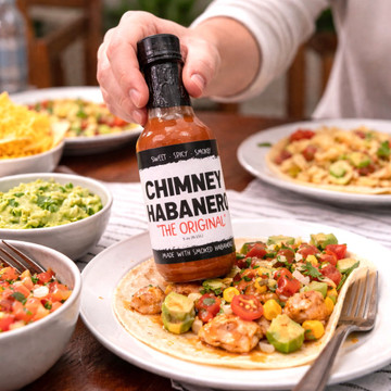 Smoked habanero hot sauce made in Alabama with bold, smoky heat. Gourmet spicy condiment for wings, tacos, grilling, and gift giving.