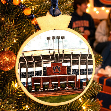 Jordan-Hare Stadium wooden ornament featuring detailed Auburn University stadium artwork, natural wood frame, and blue hanging ribbon.