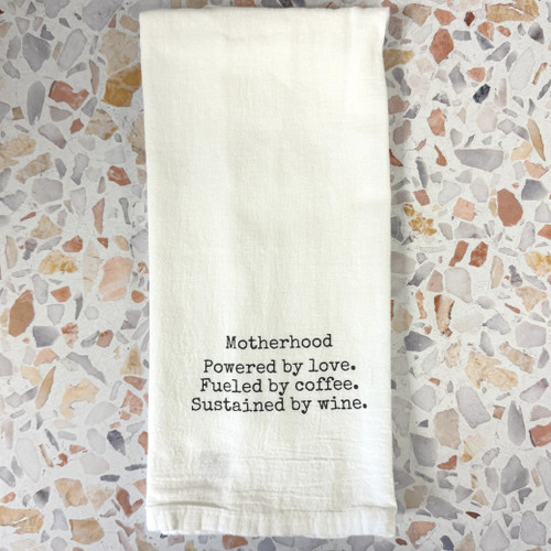 Funny mom kitchen towel in blue flour sack cotton, styled in a bright kitchen setting, showcasing printed humor design, Alabama-made gift item