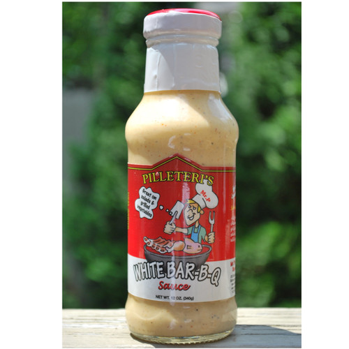 Grilled chicken with Alabama white BBQ sauce, Mr. P’s BBQ sauce bottle, creamy white barbecue sauce close-up, Southern BBQ cookout with white sauce
