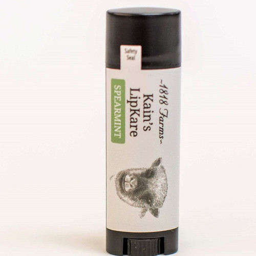 Kain’s LipKare lip balm in black oval tube, Alabama handmade lip balm, spearmint lip balm close-up, 1818 Farms lip care product