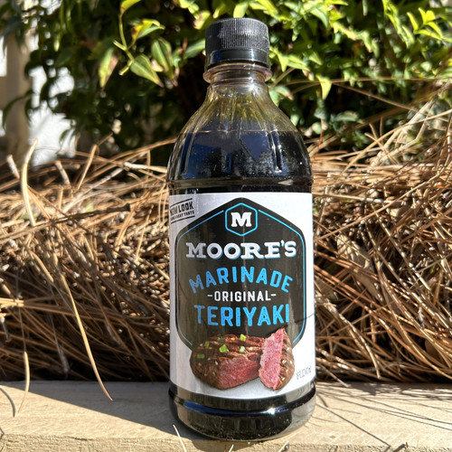 Grilled chicken glazed with teriyaki marinade, glossy sauce texture in bottle, teriyaki marinade being brushed on meat, gourmet marinade styled on kitchen counter