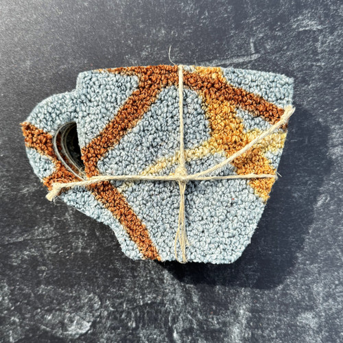 Coaster set made from upcycled carpet shaped like coffee mugs, showing varied colors and textures, eco-friendly Alabama-made gift