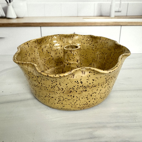 Handcrafted Alabama stoneware quarter pound cake baking dish by June Bug Pottery with scalloped edges and artisan glaze finish