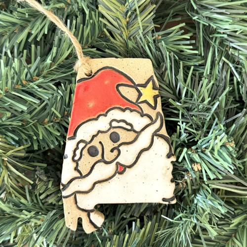 Handmade Alabama pottery Christmas ornament featuring whimsical Santa with star-tipped hat, hand-painted Southern holiday keepsake made in Alabama