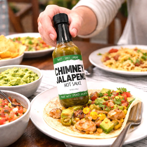 Smoked jalapeño hot sauce made in Alabama with smoky, sweet heat. Versatile gourmet condiment for tacos, grilling, and everyday flavor.