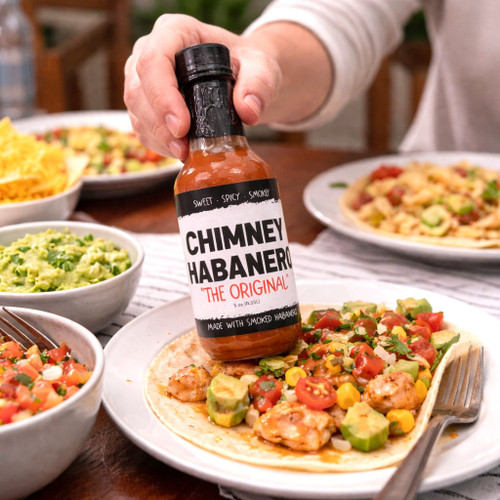 Smoked habanero hot sauce made in Alabama with bold, smoky heat. Gourmet spicy condiment for wings, tacos, grilling, and gift giving.