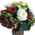 Antique hydrangeas combine with white roses and red berries for a beautiful holiday gift.