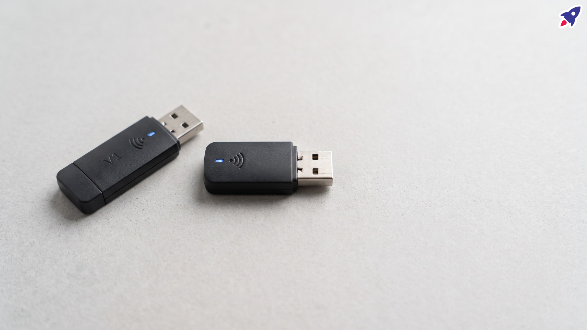 Yealink WF50 and WF50 V1 Wi-Fi dongles side by side, showing the V1 marking that distinguishes them.