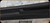 Consign - Benelli - 12Ga/3.5"/18" - Nova - Pump Action Shotgun - Black Synthetic Stock/Black Finish, c/w Tube Extension & TacStar Side carrier - less than 50rds fired