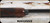 Consign - Remington - 12Ga/2.75"/28" - Model 1100 Premium Sporting 12 - Grade AA Gloss Walnut Stock/Engraved Nickel Receiver/Blued Barrels, c/w (2)chokes Carlson LM & Skeet - in Green Remington Hard case