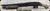 Mossberg - 12Ga/3"/14.375" - Model 590 Shockwave - Pump Action - Woodland Camo Synthetic Stock/Black Finish, 5+1 Capacity, Mfg# 50634