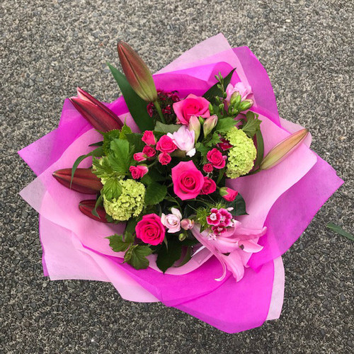 This Glamorous bouquet will fill any home with the sweet smell of freesias and oriental lilies.
Includes other seasonal blooms and foliages. 