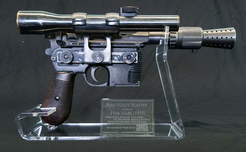 Han Solo DL-44 Blaster Stand with Plaque shown with blaster for illustration. 