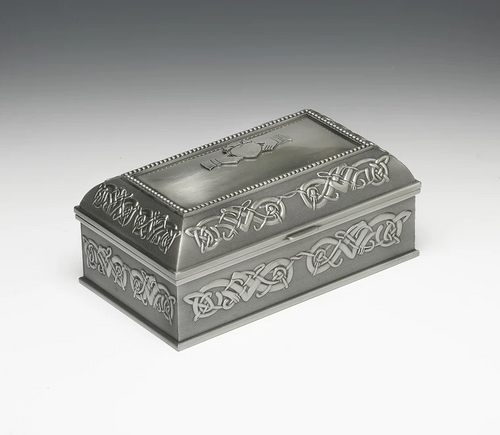 There are three beautiful jewellery box sizes to choose from. This is the large size which is 7" long. Each are embossed on all sides and lid with a Celtic design.  The top of the box can be plain or you can have it with the Claddagh insignia.The interior is lined with red felt with a compartment for rings/earrings and other precious items. 
The design is that of the Claddagh taken from the famous love symbol designed in the town of Claddagh, Co. Galway by Richard Joyce back in the year 1689. The design is often used for wedding rings as it is based on the ring that Richard made for his bride to be. The symbolisms are "hands for friendship", "heart for love" and "crown for loyalty".
The perfect gift for that someone special in your life. There are three beautiful jewellery box sizes to choose from. This is the large size which is 7" long. Each are embossed on all sides and lid with a Celtic design.  The top of the box can be plain or you can have it with the Claddagh insignia.The interior is lined with red felt with a compartment for rings/earrings and other precious items. 
The design is that of the Claddagh taken from the famous love symbol designed in the town of Claddagh, Co. Galway by Richard Joyce back in the year 1689. The design is often used for wedding rings as it is based on the ring that Richard made for his bride to be. The symbolisms are "hands for friendship", "heart for love" and "crown for loyalty".
The perfect gift for that someone special in your life.