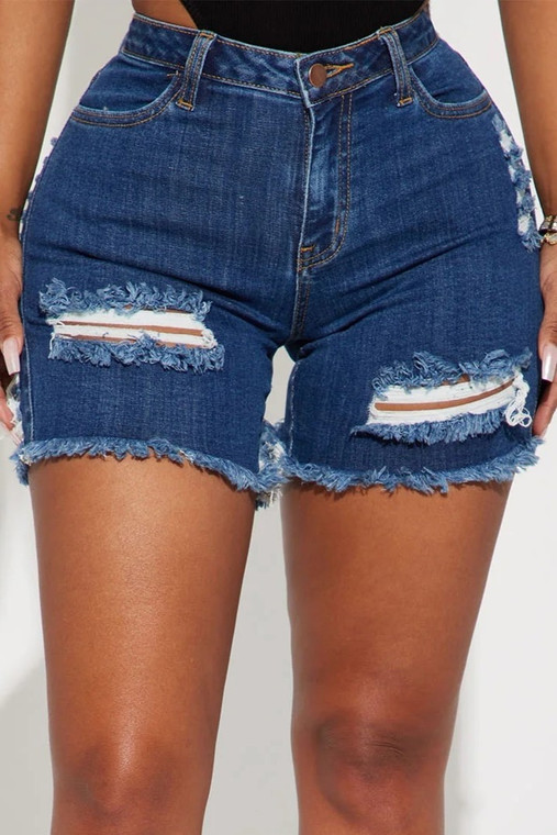 Outside this summer : disstressed denim shorts 