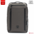 Front view of the Beside-U Daybreak gray laptop backpack designed for 13-inch laptops, featuring black vertical accent webbing, multiple zippered organizational pockets, a metal logo emblem, and attached keychain accessory.