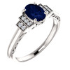 14 Karat White Gold  Lab Grown Oval Blue Sapphire and .05 Carat Diamond Ring