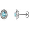 14 Karat White Gold Genuine Blue Zircon and 0.13 Carat Diamond Halo Style Earrings