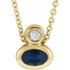 14 Karat Yellow Gold 5x3 mm Oval Lab Grown Blue Sapphire and .03 Carat Diamond 16 inch Necklace