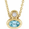 14 Karat Yellow Gold 5x3 mm Oval Blue Zircon and .03 Carat Diamond 16 inch Necklace