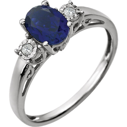 Lab Blue Sapphire set in 14 Karat White Gold Created Sapphire and .04 Carat Diamond Ring