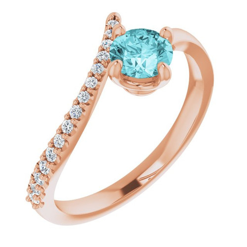 Blue Zircon in 14 Karat Rose Gold  Blue Zircon and 0.10 Carat Diamond Bypass Ring