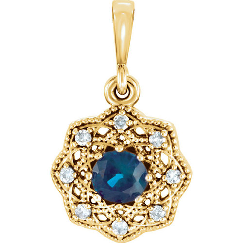 14 Karat Yellow Gold Blue Sapphire and .06Carat Diamond Halo Style Pendant