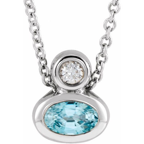 14 Karat White Gold 5x3 mm Oval  Blue Zircon and .03 Carat Diamond 16 inch Necklace