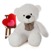 White teddy bear with heart shape pillows