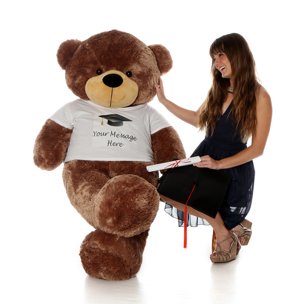 A Woman Is Posing Next to a Giant Teddy Bear