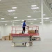 Scissor lift lowered on a warehouse floor
