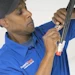 Installer attaching a connector to coax cable