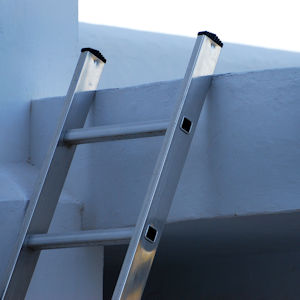 Ladder against the roof of a house