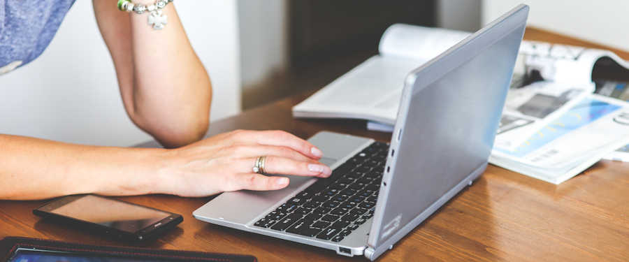 Woman typing on laptop